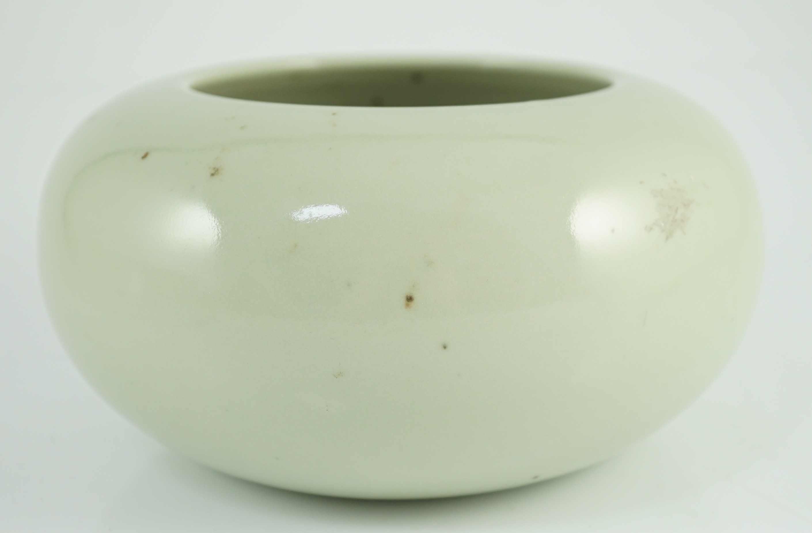 A Chinese celadon glazed water pot or alms bowl, late 19th century, 19cm diameter